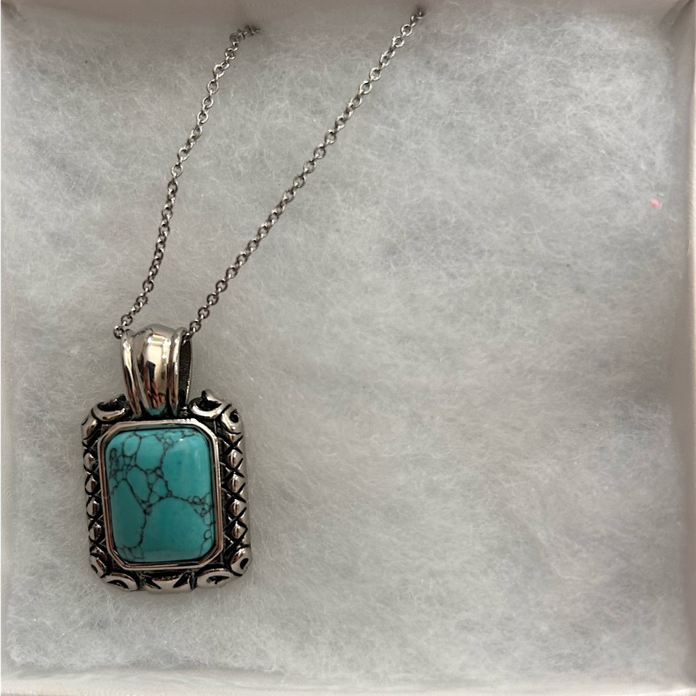 Turquoise and silver pendant necklace